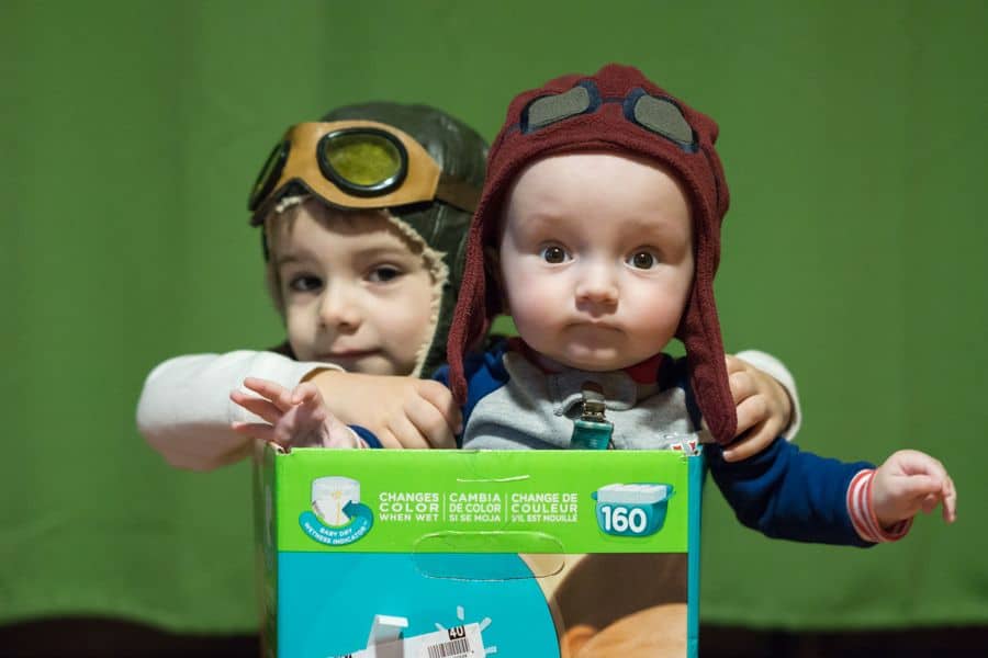 Creative Play - boys wearing goggle hats in a cardboard box