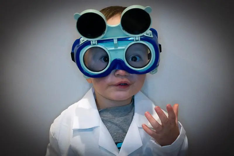 toddler in science labcoat - what is STEM