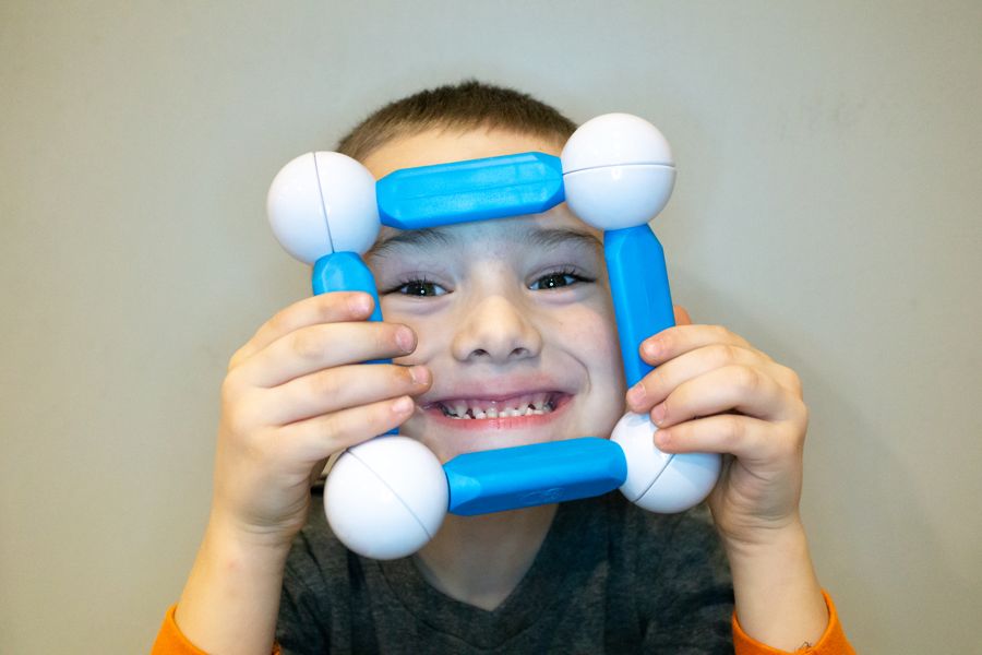 Boy Playing with Magnetic Building STEM Toy