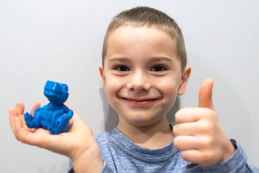 Happy Boy with a 3D printed Dinosaur