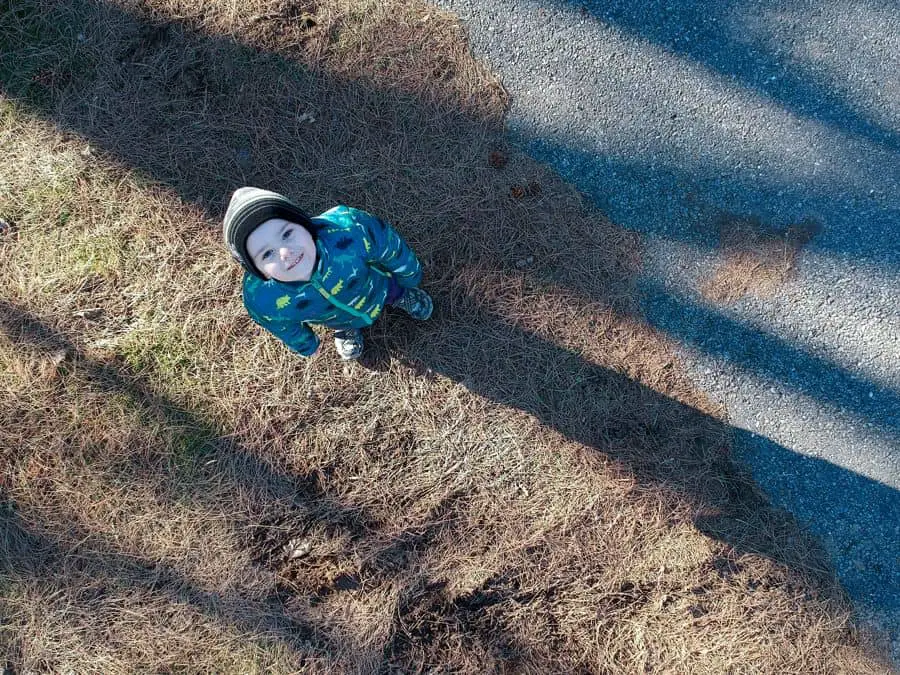 Young Boy watching drone quadcopter