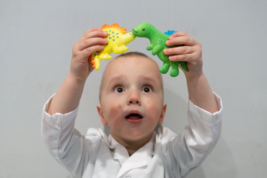 Young Boy Surprised at Growing Dinosaur Activity