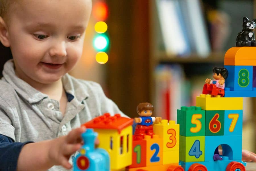 Young Child playing with Duplo Counting Train STEM Toy