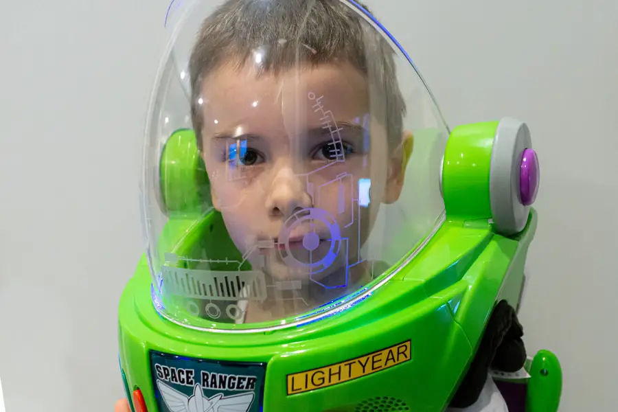 Boy wearking Buzz Lightyear Helmet for Space Play